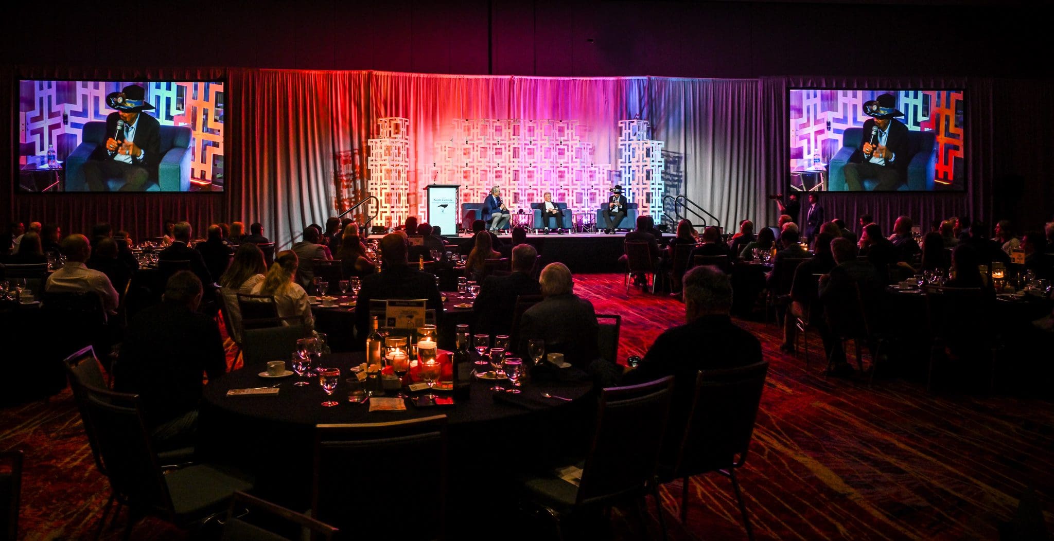 Panel discussion with large seated audience